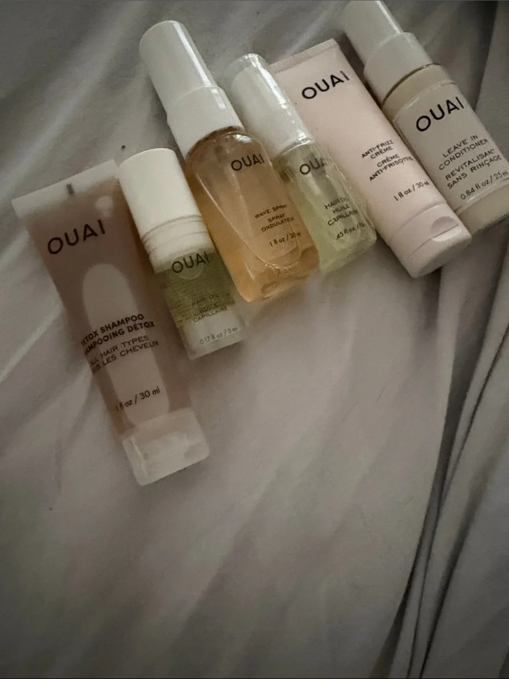 OUAI Travel Hair Set — Neutral & Pale Pink Bottles